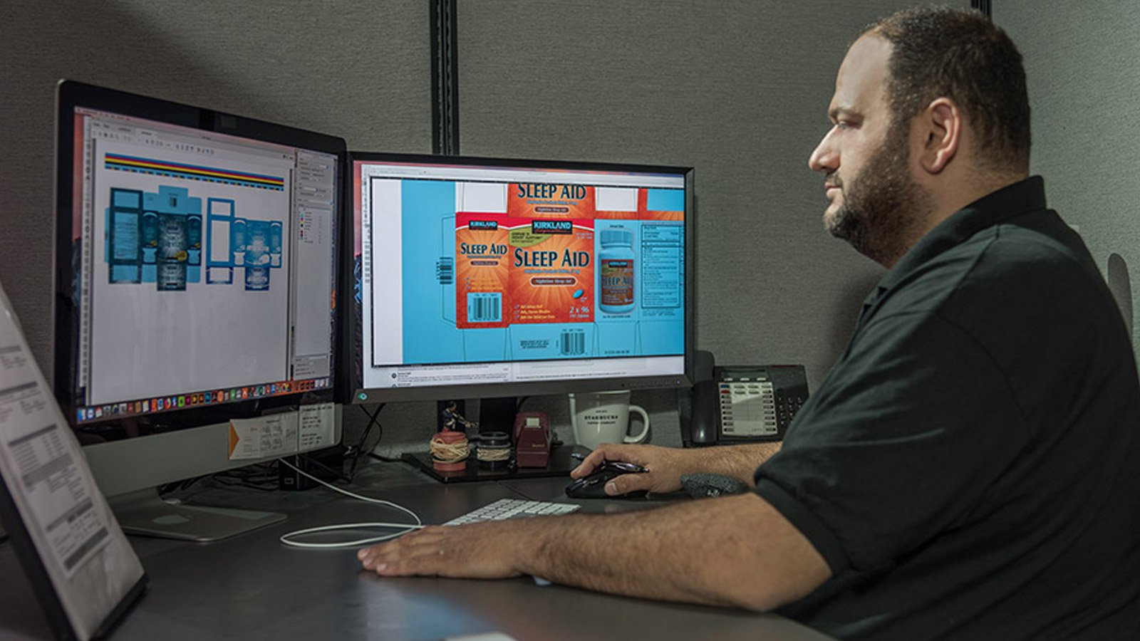 Employee analyzing pharmaceutical packaging on their computer