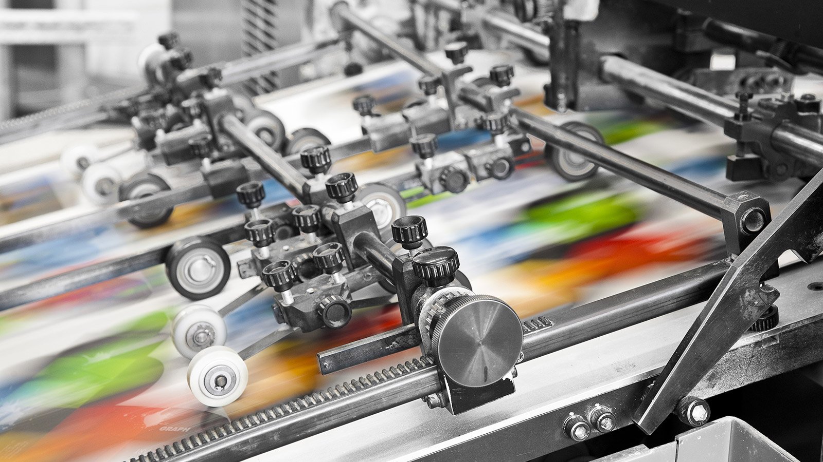 Close up of an offset printing machine during production