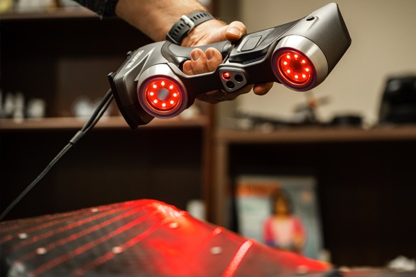 red 3D Scanner being used by a professional